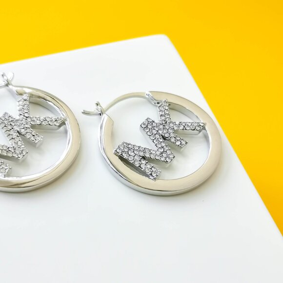 Pave Hollow Logo Silver plated Hoop Earrings by Michael Kors - Picture 2 of 3